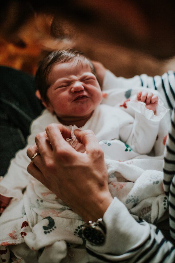 baby fussing with scrunched face